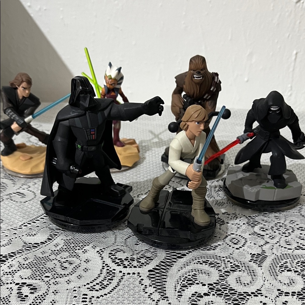 From Disney’s Infiniti game 3.0, Star Wars figure/game pieces